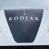 Kodiak Ultimate decal on a vehicle roof with a clear sky background